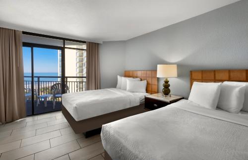 Ένα ή περισσότερα κρεβάτια σε δωμάτιο στο Hotel Blue