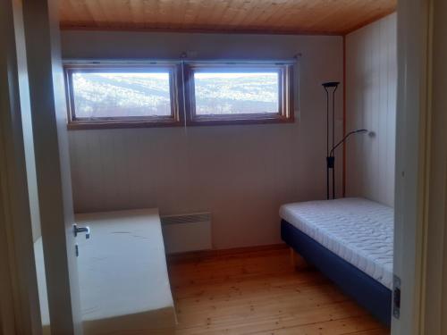 Postel nebo postele na pokoji v ubytování VARANGER KITE CAMP