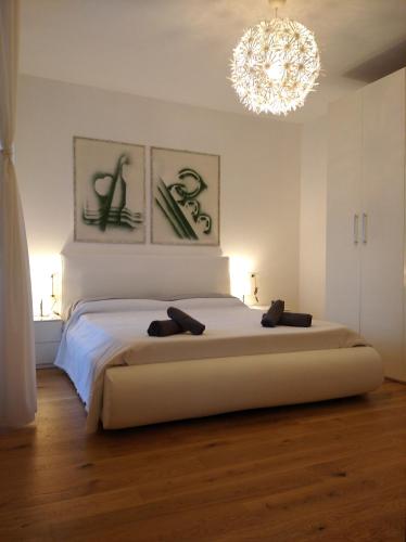 Ένα ή περισσότερα κρεβάτια σε δωμάτιο στο Belvedere Home vista mare e comfort
