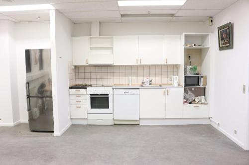 A kitchen or kitchenette at Budget Rooms Copenhagen