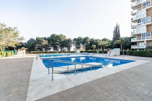 a large swimming pool in a apartment complex at Sun Coast Benalmádena -- Superb studio with 4 pools, gardens & breakfast in Benalmádena