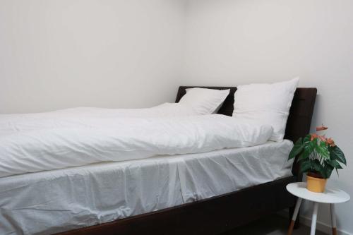 Ένα ή περισσότερα κρεβάτια σε δωμάτιο στο Budget Rooms Copenhagen