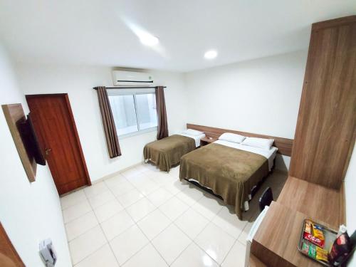 Postel nebo postele na pokoji v ubytování Kaluff Hotel