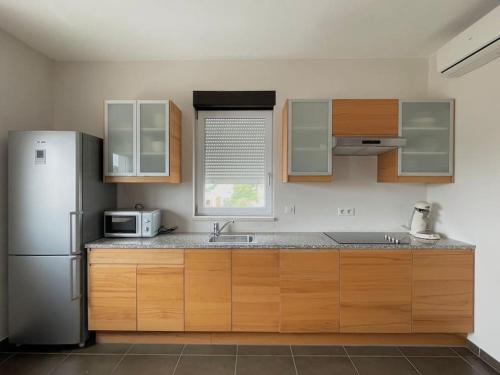 Virtuvė arba virtuvėlė apgyvendinimo įstaigoje Appartement MB - Logement 3 chambres - Drage