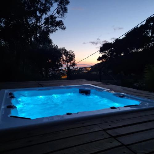 a swimming pool in the middle of a backyard at Place of Moments Natur-Suites SPA in Vila Franca do Campo
