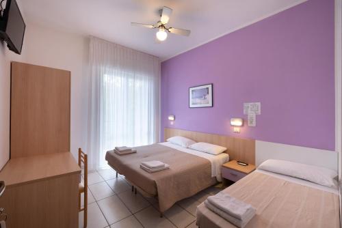 Postel nebo postele na pokoji v ubytování Hotel Giordo