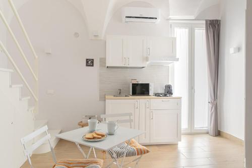 Kuchyňa alebo kuchynka v ubytovaní Mare all'Arco Casa Vacanze