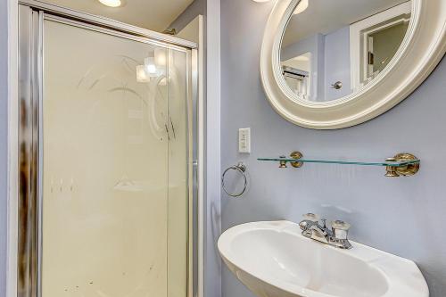 a bathroom with a sink and a mirror at 30 22nd Ave in Isle of Palms