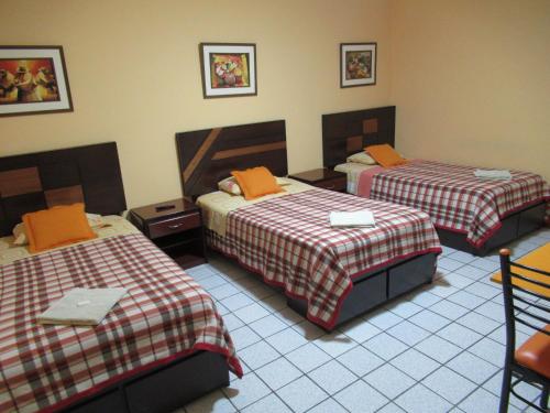 Ένα ή περισσότερα κρεβάτια σε δωμάτιο στο Kurmi Hostel Lima Airport