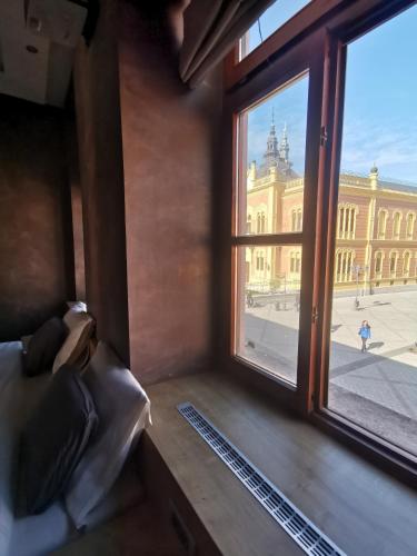 a room with a window with a view of a building at Lux A28 in Novi Sad