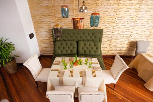 a dining room with a white table and chairs at Radisson San Jose-Costa Rica in San José