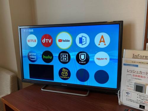 a flat screen tv sitting on top of a table at Hotel RESH Tottori Ekimae - Vacation STAY 47404v in Tottori