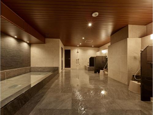 a large room with a bathroom with a sink at Hotel RESH Tottori Ekimae - Vacation STAY 47361v in Tottori
