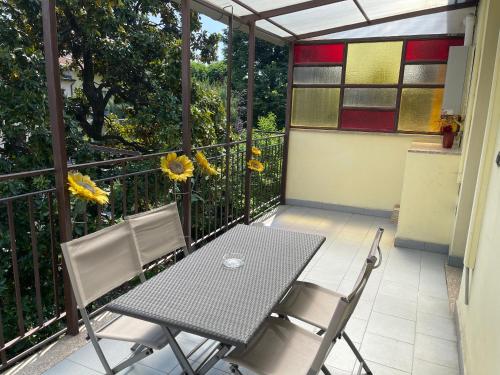 a table and two chairs on a balcony at Appartamenti Aspromonte in Milan