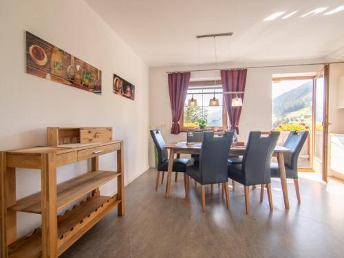 a dining room with a table and chairs at Haus Kienast in Ellbögen