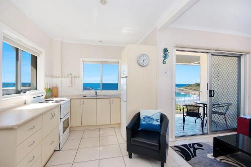 a kitchen with a view of the ocean at Boorolong 3 - Linen not provided in Yamba