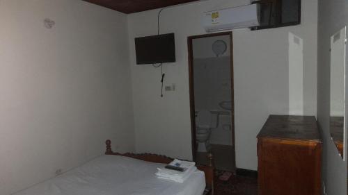 Postel nebo postele na pokoji v ubytování HOTEL en MONTERIA CITY