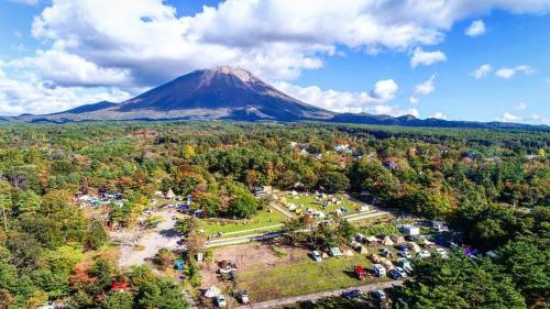 an aerial view of a mountain in the distance at First Class Backpackers Inn DAISEN - FBI DAISEN in Daisen