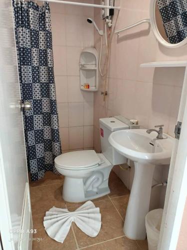 a bathroom with a toilet and a sink at Uphill Cottage in Phi Phi Islands
