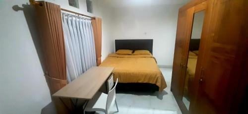 Ένα ή περισσότερα κρεβάτια σε δωμάτιο στο The Balisunny House