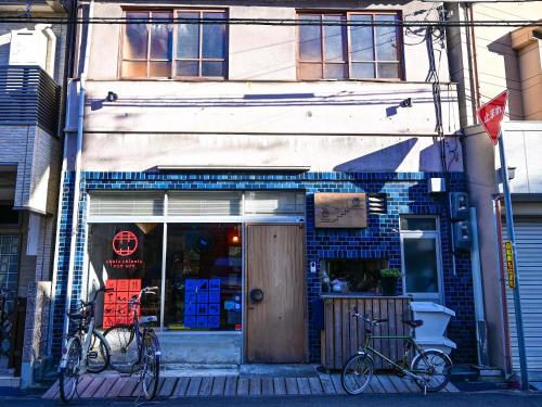 two bikes parked in front of a store at Kawaramachi Domitory in Takamatsu
