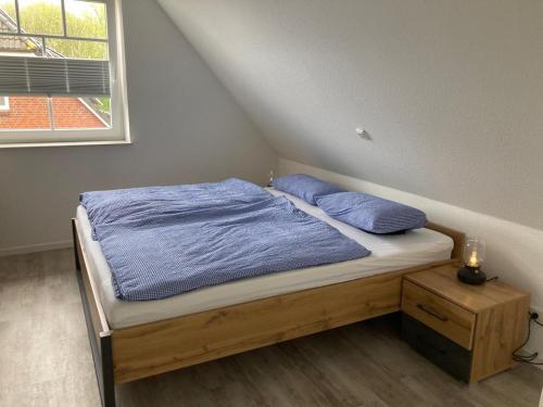 Tempat tidur dalam kamar di Traumfänger Urlaub direkt am Meer