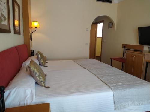 Letto o letti in una camera di Área de Servicio El Cruce
