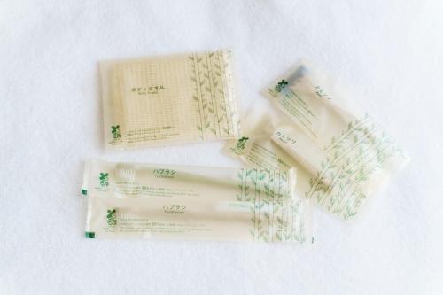 a group of four toothbrushes sitting on a table at Bears Stay Kumejima Eef Beach in Kumejima