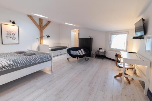 a bedroom with a bed and a desk and a desk at Sopot, the very heart! in Sopot