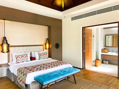 a bedroom with a large bed and a bathroom at Silla Villa Private Pool & Sea View in Kata Beach