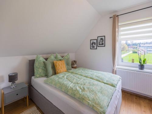 a bedroom with a large bed and a window at Apartment in Kühnsdorf am Klopeiner See in Völkermarkt