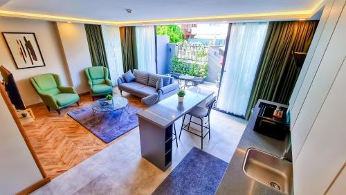 a living room with a couch and chairs at Letstay Sweet Home Mint in Antalya