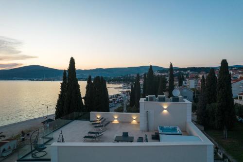 a view of a building with a view of the water at Ero on the beach in Trogir