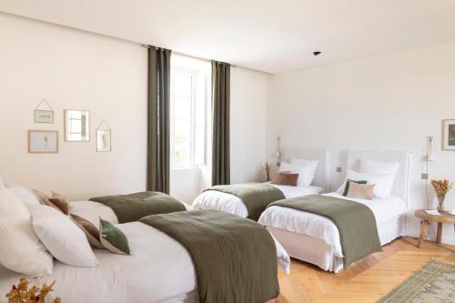 Katil atau katil-katil dalam bilik di Château Toulouse-Lautrec