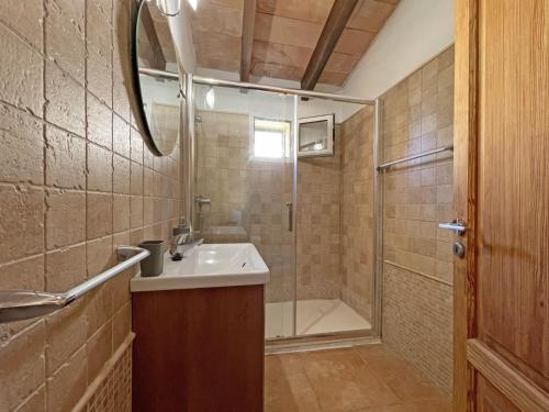 a bathroom with a sink and a shower at Finca Caseta Des Pradi Biel in Lloseta