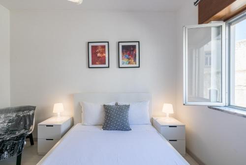 Postel nebo postele na pokoji v ubytování Lagos Classic by Homing