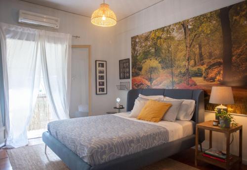 Ένα ή περισσότερα κρεβάτια σε δωμάτιο στο Nina's cozy apartment in Mikrolimano