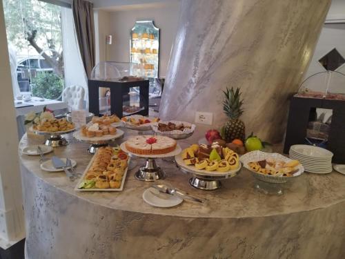 a buffet with many different types of food on a table at The Moon Boutique Hotel & Spa in Florence