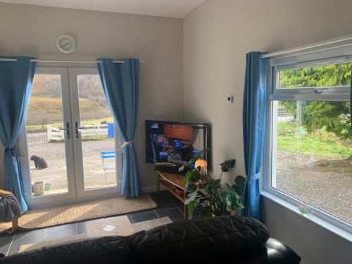 a living room with a couch and a window at The Annex in Glenelg in Glenelg