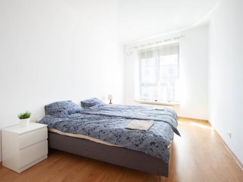 Posteľ alebo postele v izbe v ubytovaní Waw Apartamenty Wilanów Branickiego
