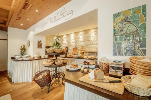 a bakery with a counter with baskets of food at Pension Edelweiss in Sölden
