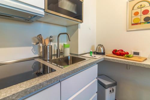 a kitchen with a sink and a counter top at MONOLOCALE CAMOGLI Rilassati in un posto bellissimo in Camogli