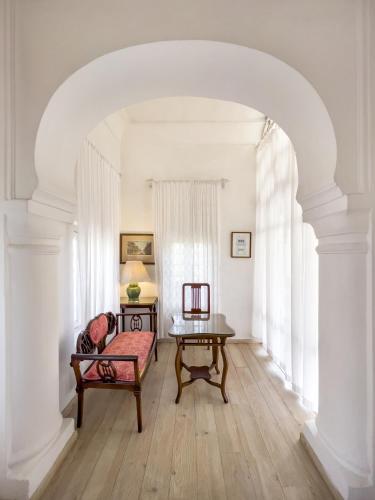 a living room with a couch and a table at Neemrana Fort-Palace in Neemrana