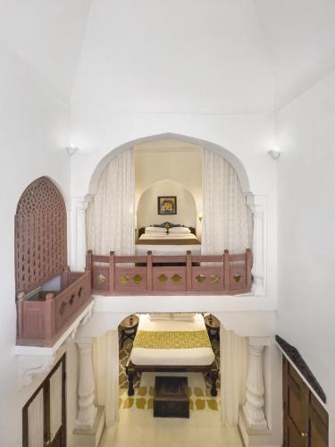 a large room with a bed in it at Neemrana Fort-Palace in Neemrana