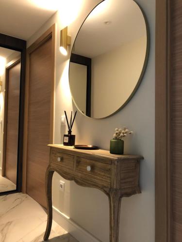 a dressing table with a mirror on a wall at Marqués Petit Premium in Denia