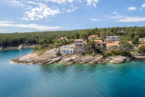 an aerial view of a house on an island in the water at Apartments Habek in Vrboska
