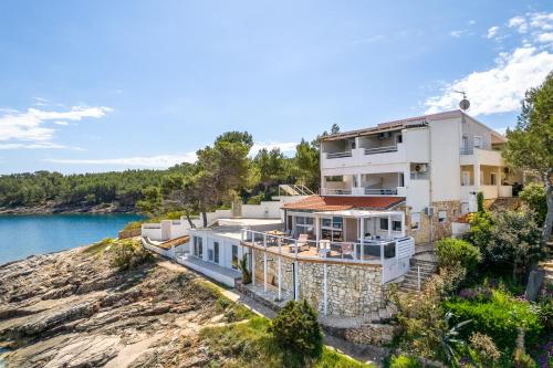 an aerial view of a house on a cliff at Apartments Habek in Vrboska
