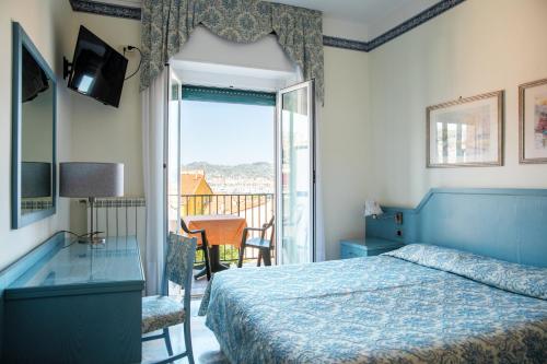 Postel nebo postele na pokoji v ubytování Hotel Ariston
