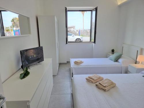 Posteľ alebo postele v izbe v ubytovaní A Casa di Papà by Holiday World