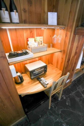 a small room with a table with a radio on it at Arrayan Lake View Mountain Lodge & Casa De Te Arrayan in San Martín de los Andes